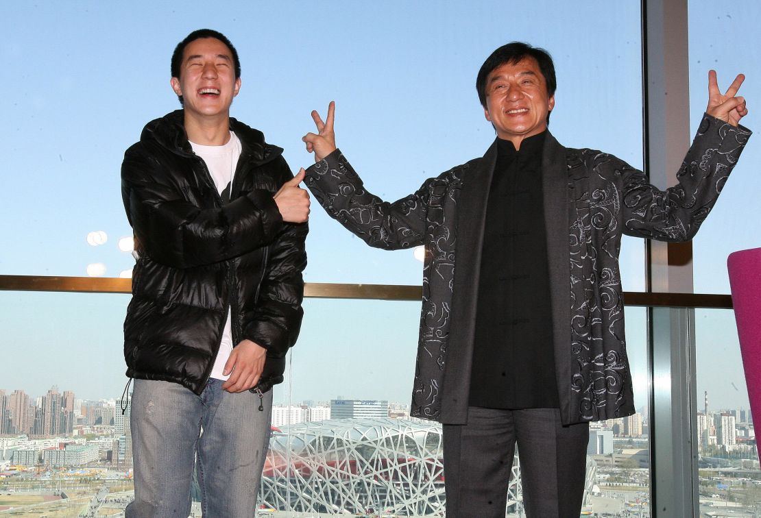 Jackie Chan (right) poses with his son Jaycee in 2009 outside Beijing's "Bird's Nest" Olympic stadium.