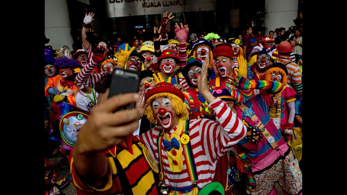 Clowns pose for a selfie during the Clown Festival in Kuala Lumpur, Malaysia, on Sunday, August 17. About 80 clowns from all over Malaysia took part in the event to provide a platform for clown education. 