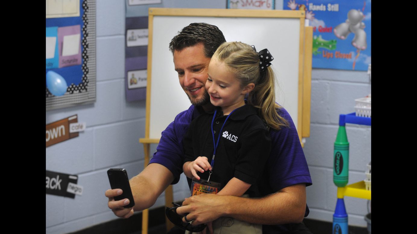 Cory Driskill gets a selfie with his daughter, Addie, on her first day of kindergarten Thursday, August 14, in Abilene, Texas.