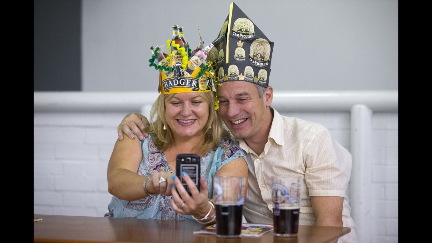 Visitors take a selfie at the Great British Beer Festival on Thursday, August 14, in London.