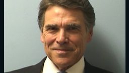 Texas Gov. Rick Perry was booked on Tuesday on two felony charges related to his handling of a local political controversy.