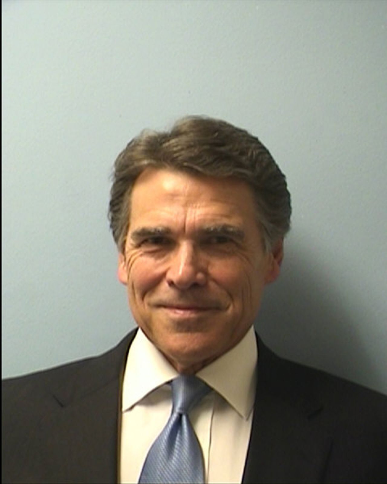 Perry was booked on August 19, 2014, on two felony charges related to his handling of a local political controversy. He vowed to fight the charges.