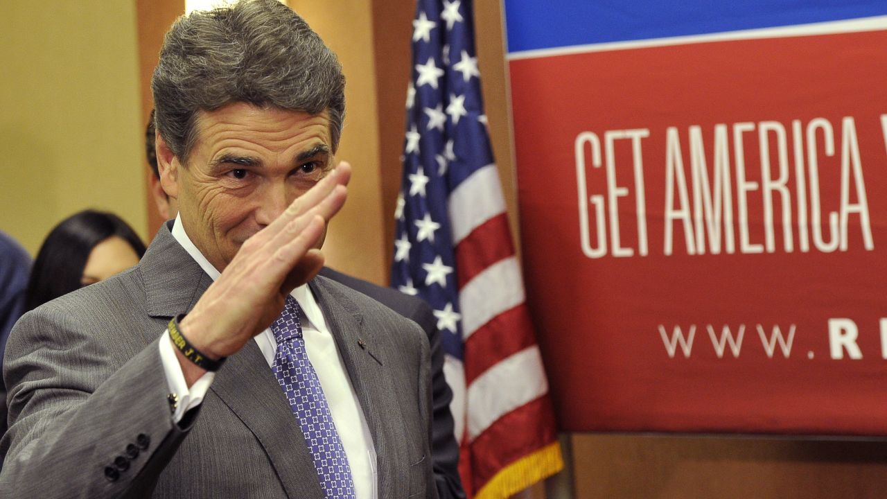 Perry salutes after announcing on January 19, 2012, that he's suspending his presidential campaign just days before South Carolina's GOP primary. Perry finished sixth in the New Hampshire primary earlier that month.