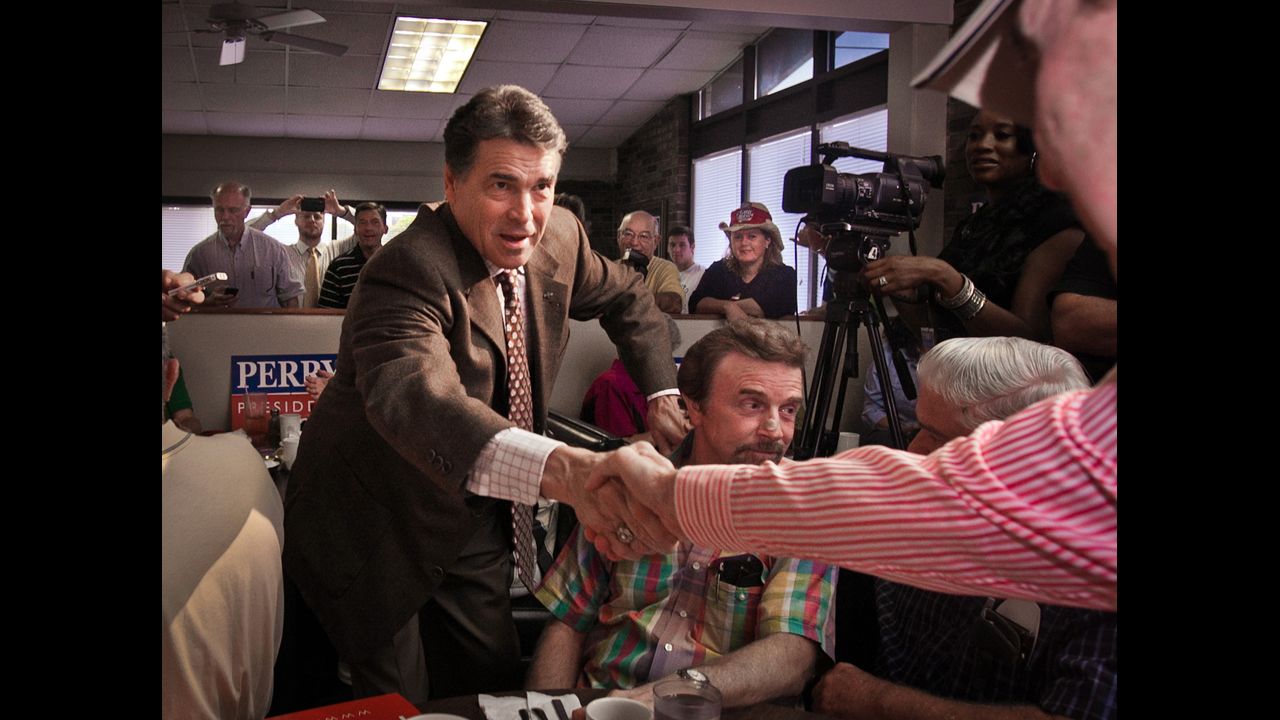 In the inaugural stages of his 2012 presidential run, Perry mingles with a breakfast crowd during a campaign stop at Bazen's Family Restaurant in Florence, South Carolina, on August 19, 2011. 