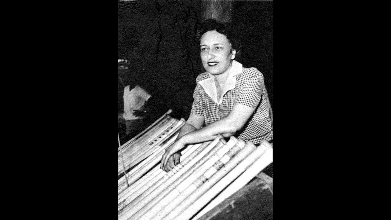 Negro League Newark Eagles baseball team owner Effa Manley poses with bats in the dugout in Ruppert Stadium in Newark, New Jersey, in 1948. Manley was the first woman elected and inducted to the Baseball Hall of Fame.