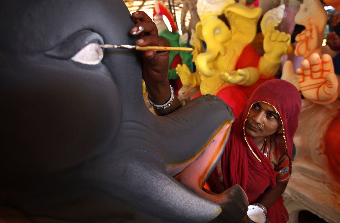 AUGUST 20 - CHENNAI, INDIA: An artisan adds finishing touches to an idol of the elephant-headed Hindu God Ganesh at a workshop on the outskirts of Chennai on August 19. The idols are being prepared ahead of the Ganesh Chaturthi festival that celebrates the birthday of the God.