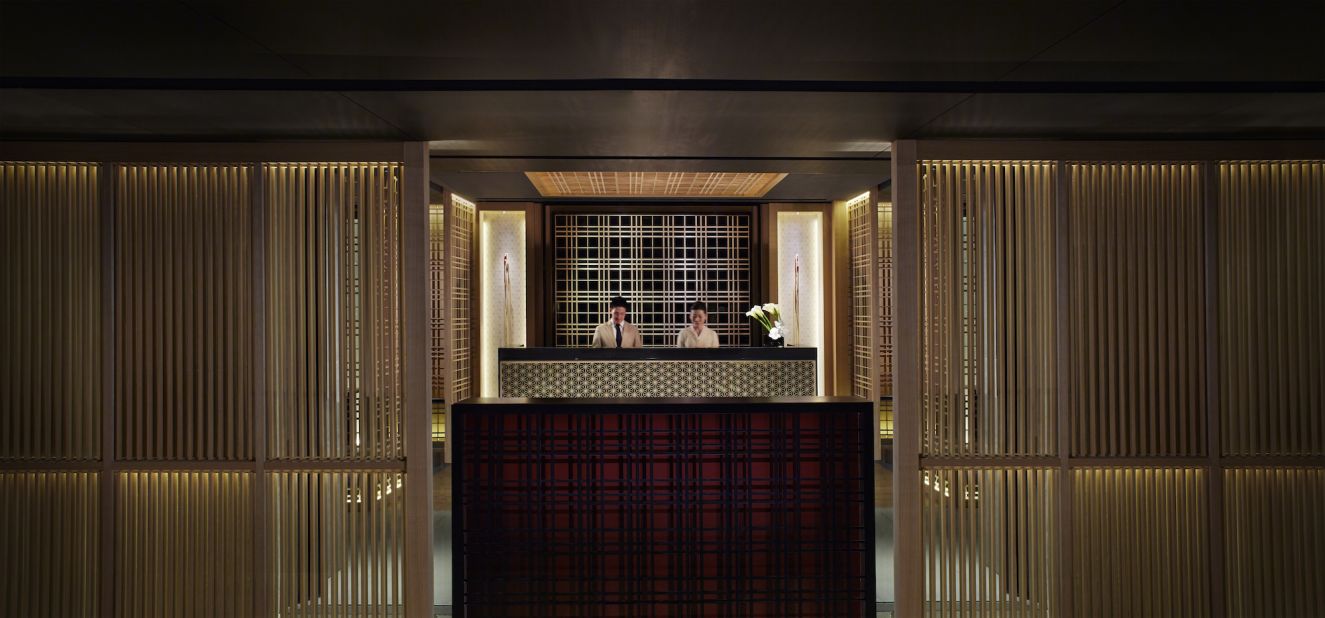 Designers of Ritz-Carlton, Kyoto infused the character and aesthetic of a traditional Meiji house and courtyard into the architectural structure of the building, as seen here at the front desk. 