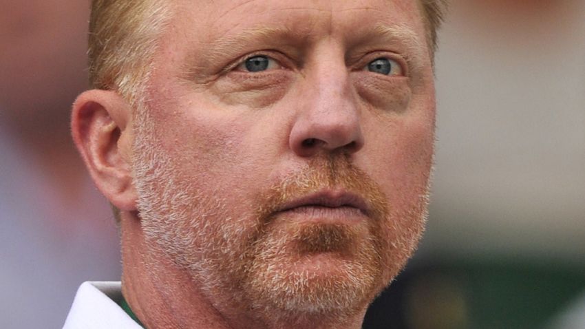 Serbia's Novak Djokovic's coach German Boris Becker attends his men's singles first round match against Kazakhstan's Andrey Golubev on day one of the 2014 Wimbledon Championships at The All England Tennis Club in Wimbledon, southwest London, on June 23, 2014. AFP PHOTO / GLYN KIRK - RESTRICTED TO EDITORIAL USE (Photo credit should read GLYN KIRK/AFP/Getty Images)