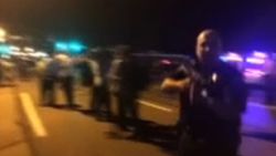 officer threatens protestors 2