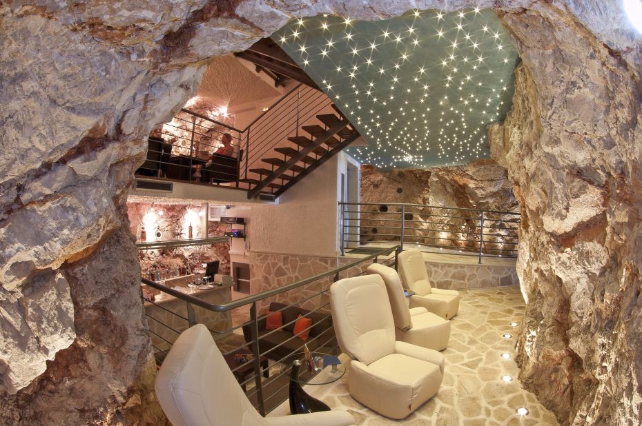 In the heart of Bar More in Dubrovnik, you'll find rocky walls illuminated purple, stalagmites and stalactites, glossy white bar counters and some serious mixology from the bartenders.