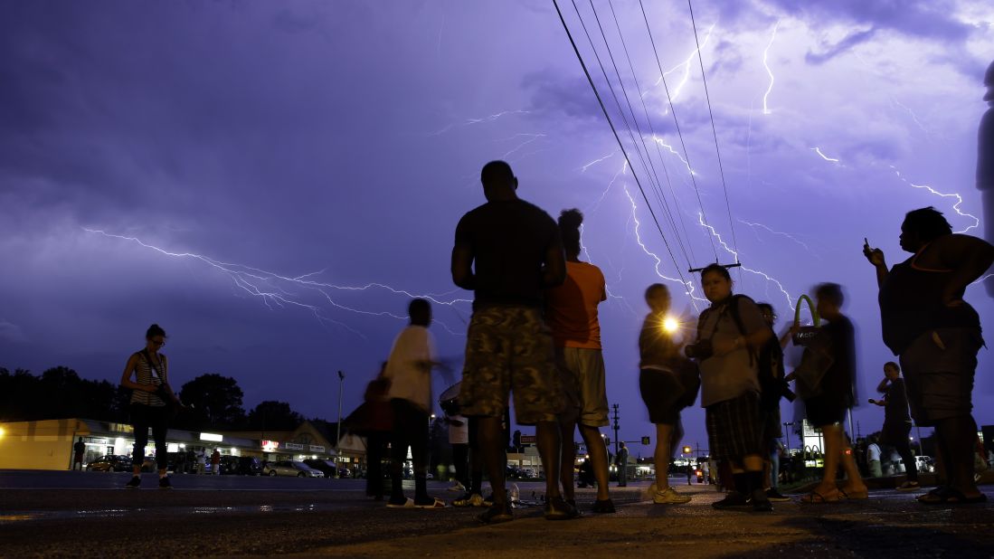 Lightning streaks over protesters on August 20, 2014. 