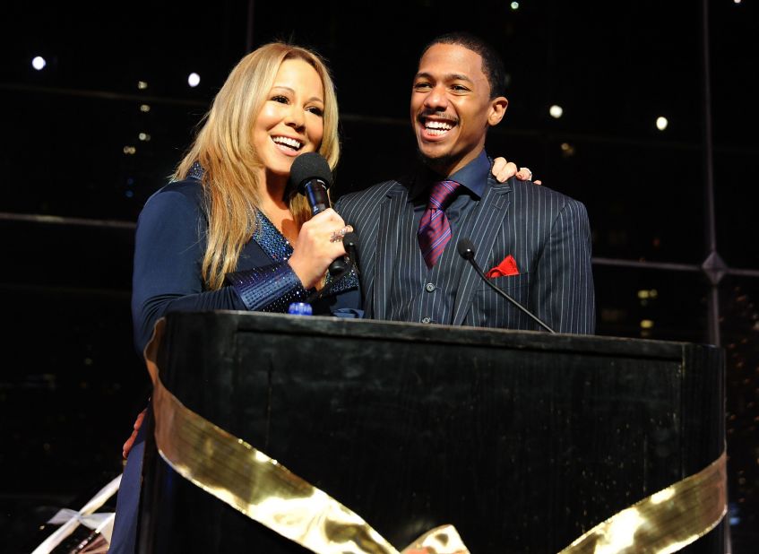 The couple shared a love of the holiday season. Here, they speak at the listening party for Carey's holiday album "Merry Christmas II You" in 2010 in New York. 