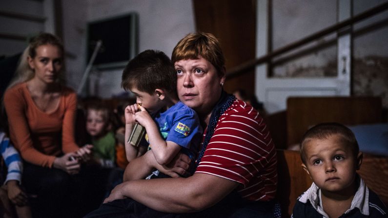 Children and their teachers hide in a bomb shelter at an orphanage in Makiyivka, Ukraine, on Tuesday, August 19. For months, Ukrainian government forces <a href="http://www.cnn.com/2014/08/07/europe/gallery/ukraine-crisis/index.html">have been battling pro-Russian rebels</a> near Ukraine's eastern border with Russia. The fighting has left more than 2,000 people dead since mid-April, according to estimates from United Nations officials.