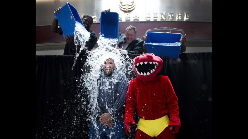 Nazem Kadri, a professional hockey player with the NHL's Toronto Maple Leafs, has water dumped on him as he and the mascot of the NBA's Toronto Raptors participate in the ALS Ice Bucket Challenge on Wednesday, August 20. Many celebrities <a href="http://www.cnn.com/2014/08/18/showbiz/celebrity-news-gossip/ice-bucket-challenge-celebs/index.html">have joined in the viral Internet campaign</a> to raise money and awareness for Lou Gehrig's disease, which is also called amyotrophic lateral sclerosis, or ALS.