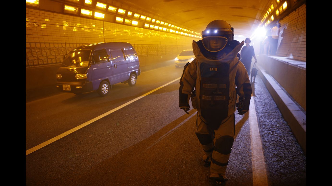 A SWAT team member wearing a bomb suit takes part in an anti-terror drill in Seoul, South Korea, on Monday, August 18.
