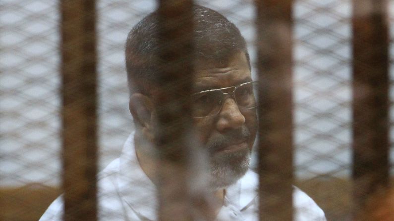 Former Egyptian President Mohamed Morsy sits inside a cage during his trial in Cairo on Monday, August 18. Morsy has faced a variety of charges since he was removed from office in a coup last year.