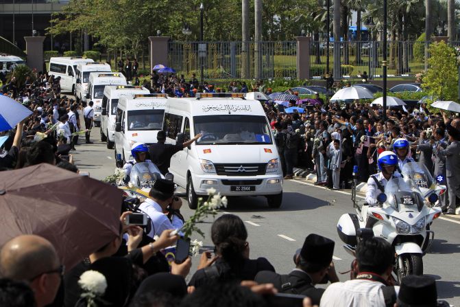 Hearses carrying victims' bodies leave Kuala Lumpur's international airport. 