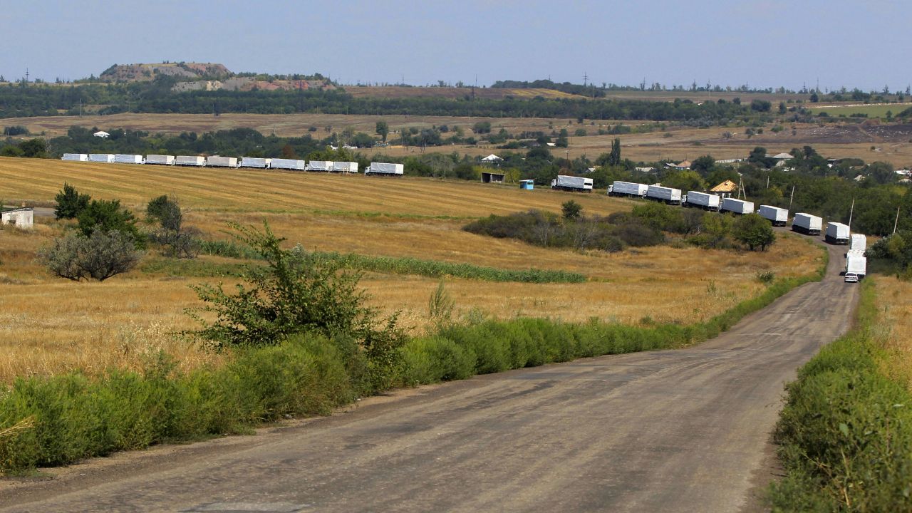 The first trucks of a Russian aid convoy roll on the main road to Luhansk in eastern Ukraine on Friday, August 22. The head of Ukraine's security service called the convoy a "direct invasion" under the guise of humanitarian aid since it entered the country without Red Cross monitors. 