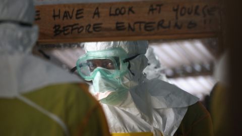 A Doctors Without Borders worker prepares to enter a high-risk area of an Ebola treatment center in Liberia.