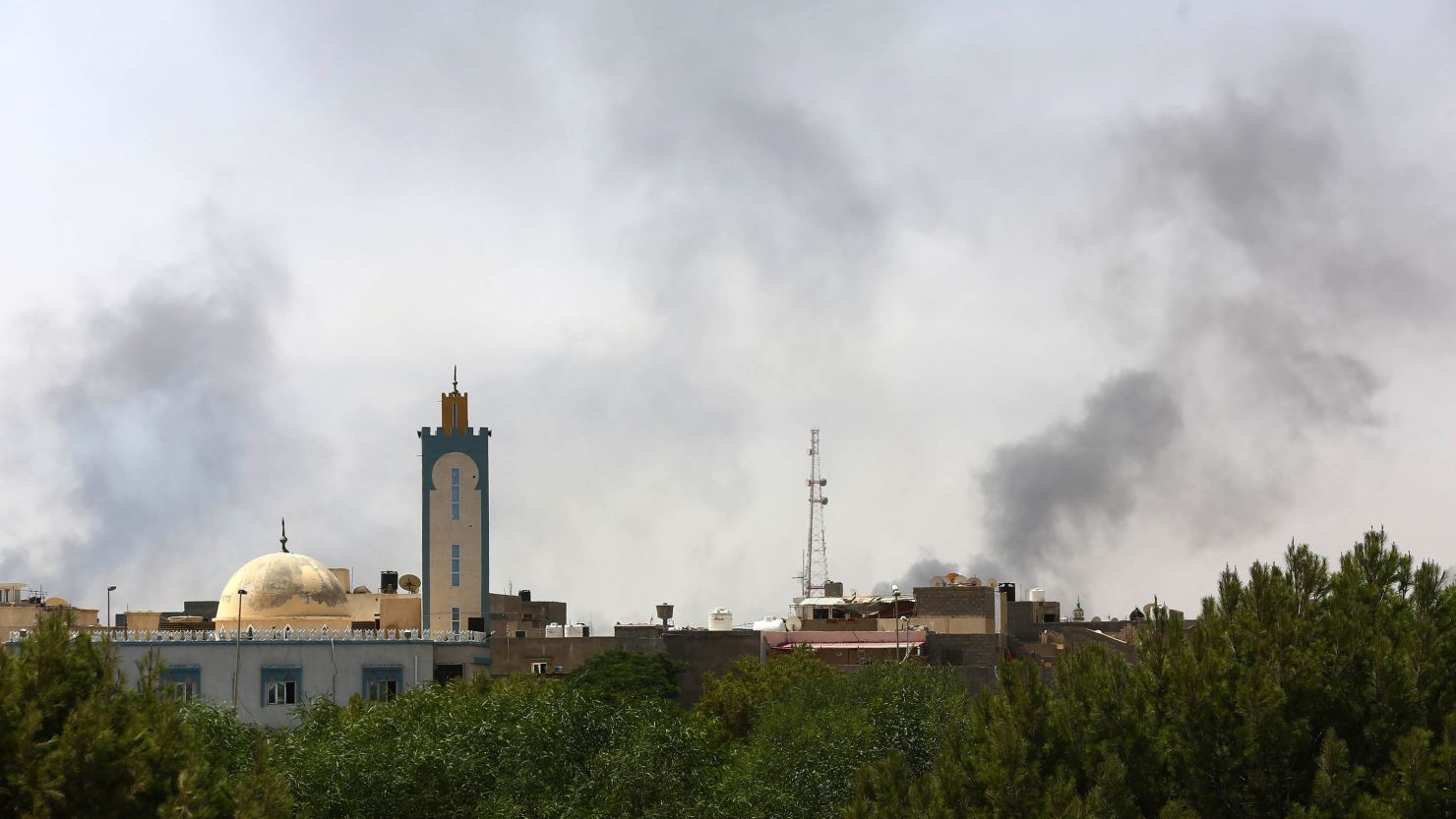 Black smoke is seen rising in the area of Tripoli International Airport where clashes have raged between Libyan militias.