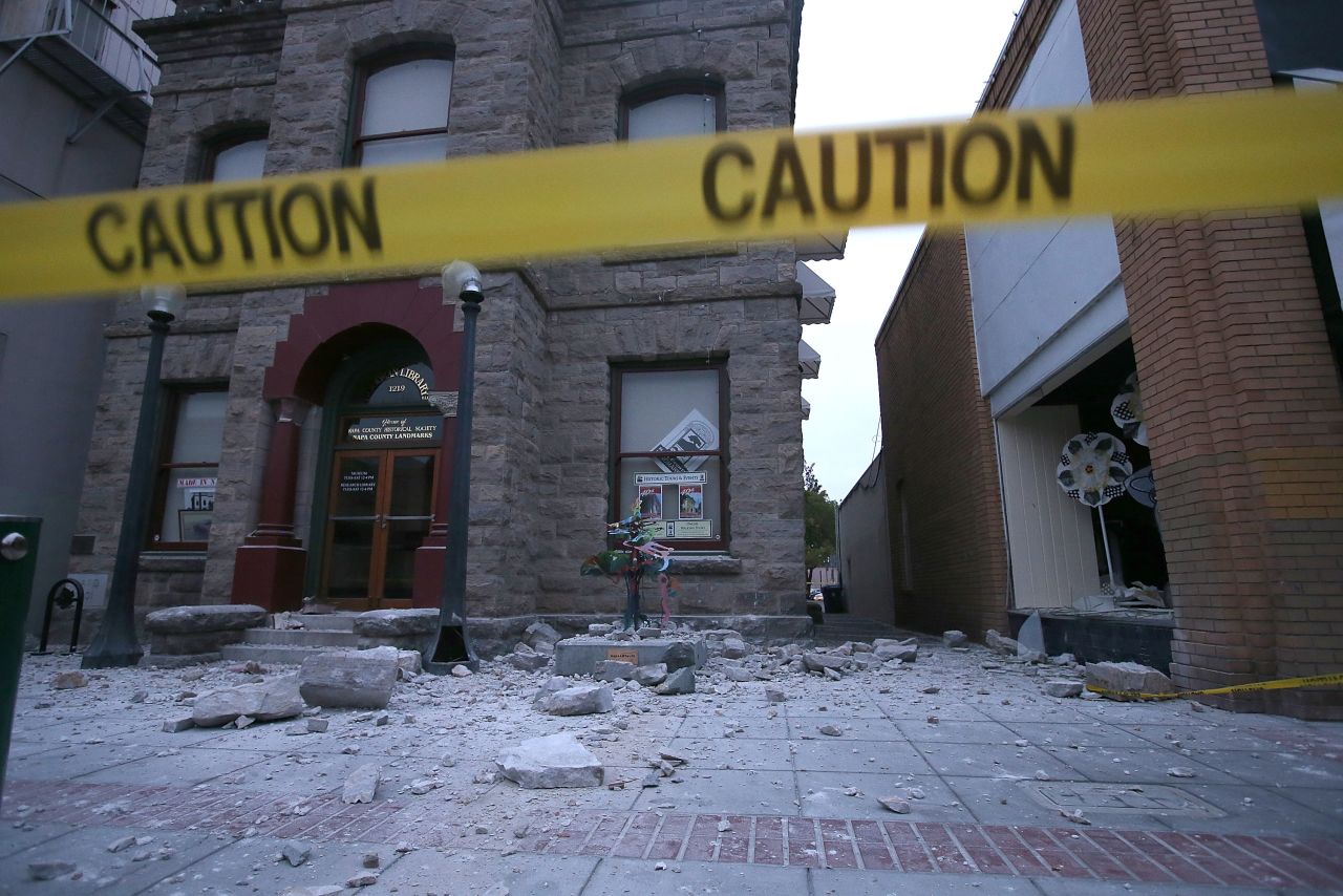  Debris litters the ground in front of a damaged building on August 24 in Napa.