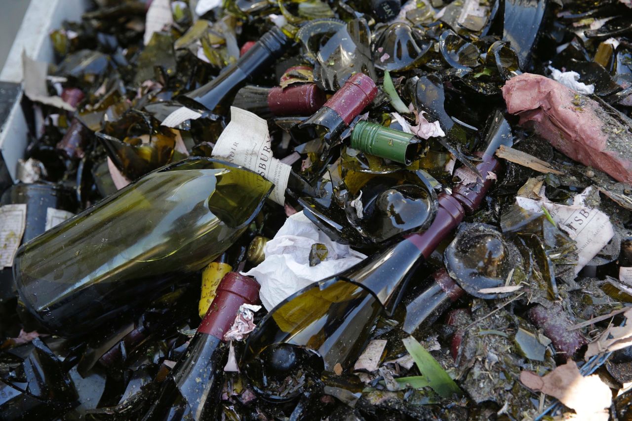 Broken bottles from the library wines of the Saintsbury winery are tossed in a grape bin on August 24 after the earthquake. 