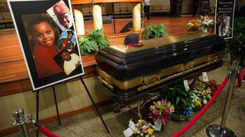 ST. LOUIS, MO - AUGUST 25: Photos surround the casket of Michael Brown inside Friendly Temple Missionary Baptist Church awaiting the start of his funeral on August 25, 2014 in St. Louis Missouri. Michael Brown,18 year-old unarmed teenager, was shot and killed by a Ferguson Police Officer Darren Wilson in the nearby town of Ferguson, Missouri on August 9. His death caused several days of violent protests along with rioting and looting in Ferguson. (Photo by Richard Perry/Pool/Getty Images)