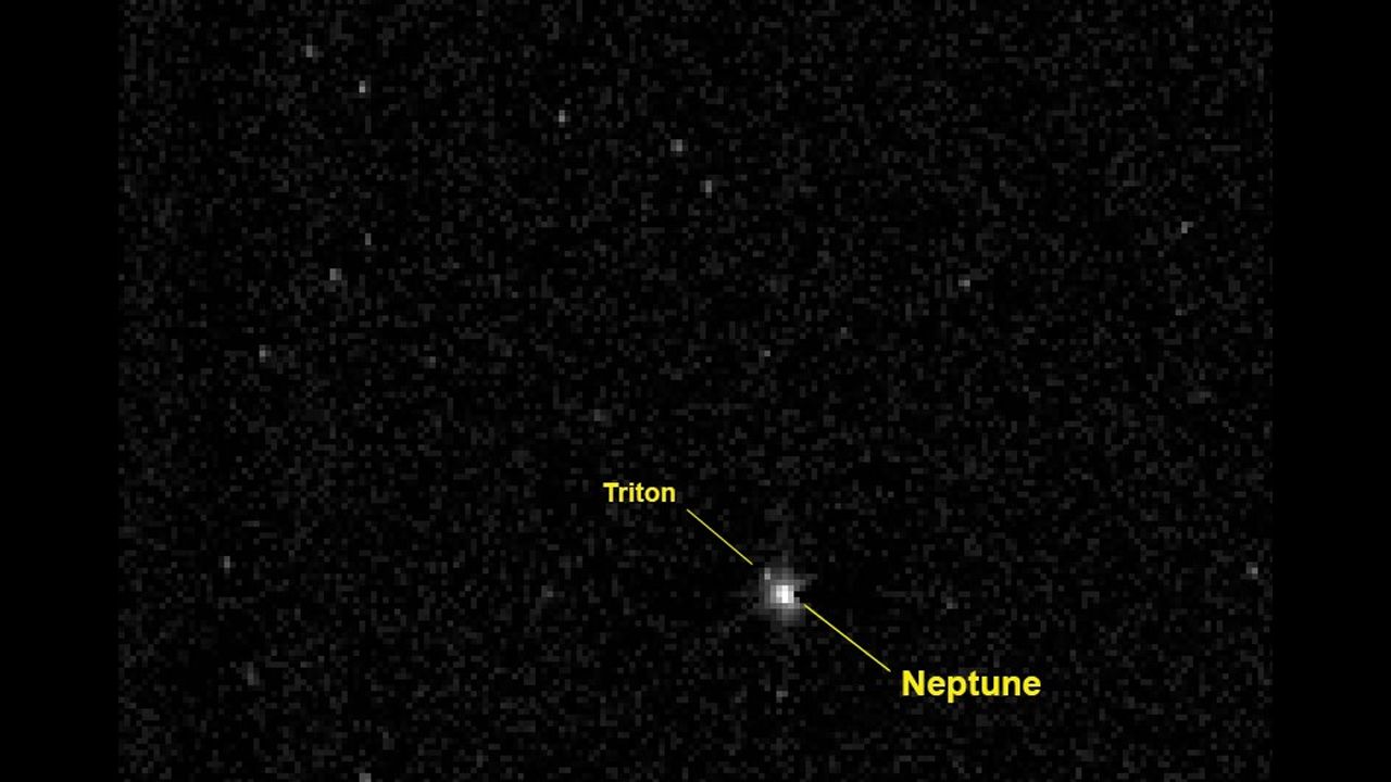 In August 2014, New Horizons crossed the orbit of Neptune, the last planet it would pass on its journey to Pluto. New Horizons took this photo of Neptune and its large moon Triton when it was about 2.45 billion miles from the planet -- more than 26 times the distance between the Earth and our sun.