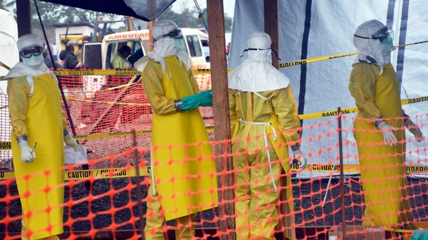 A picture taken on August 21, 2014 shows French NGO Medecins Sans Frontieres (MSF - Doctors Without Borders) staff members standing wearing protective gear at the MSF ELWA hospital in Monrovia, where patients suffering from Ebola are taken care of. The United Nations vowed on August 23 to play a "strong role" in helping Liberia and its neighbours fight a deadly outbreak of Ebola in west Africa, which it said could take months to bring it under control. Liberia has been particularly hard hit by the epidemic that has swept relentlessly across the region since March, accounting for almost half of the 1,427 deaths. AFP PHOTO / ZOOM DOSSOZOOM DOSSO/AFP/Getty Images