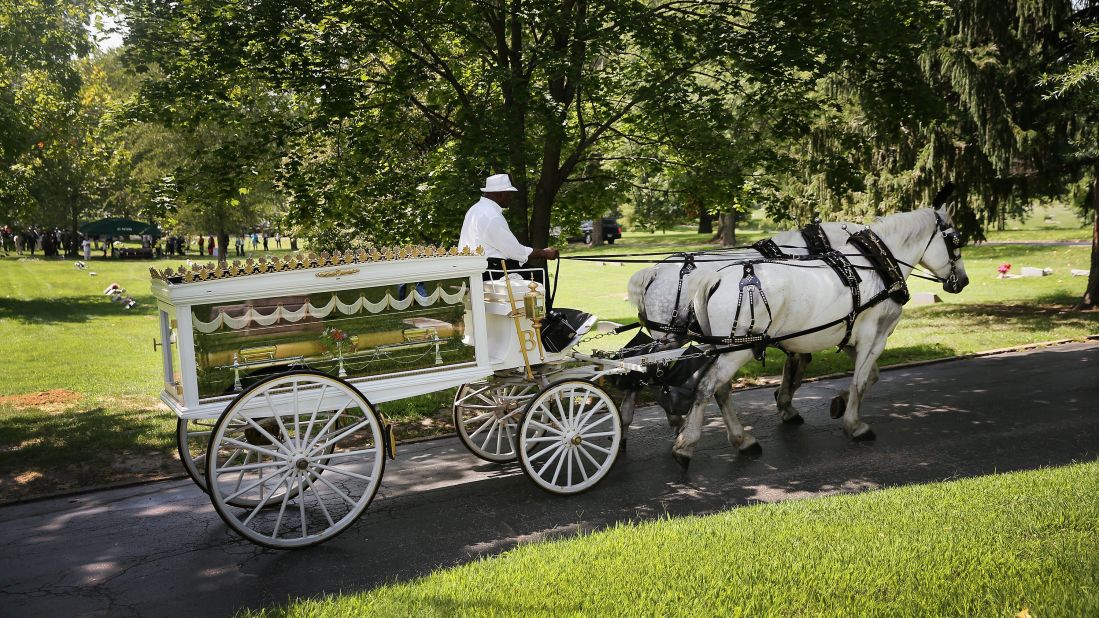 Michael Brown's casket arrives at St. Peter's Cemetery on Monday, August 25, 2014 for his funeral. Brown, 18, was shot and killed by police Officer Darren Wilson on August 9 in Ferguson, Missouri. Brown's death sparked protests in the St. Louis suburb, and a national debate about race and police actions.
