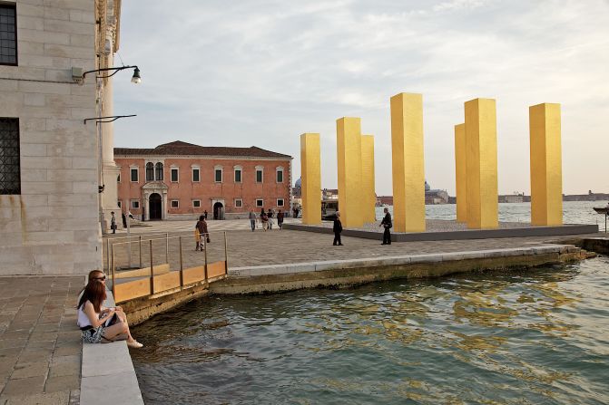 The Venice Biennale has spawned a huge selection of art exhibitions and architectural displays across the city beyond the <a href="https://www.trupilariante.com/2014/06/16/travel/venice-architecture-biennale-rem-koolhaas/">ticketed barriers of the Giardini</a>. World renowned  artists are experimenting within various historical interiors and waterfronts across Venice. Heinz Mack's gold pillars are pictured next to Palladio's Church. 