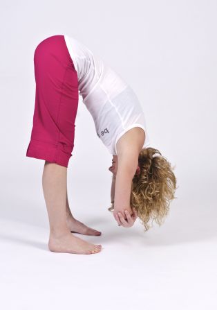 Ragdoll pose assists with proper pelvic alignment, hip hinging and hamstring lengthening.