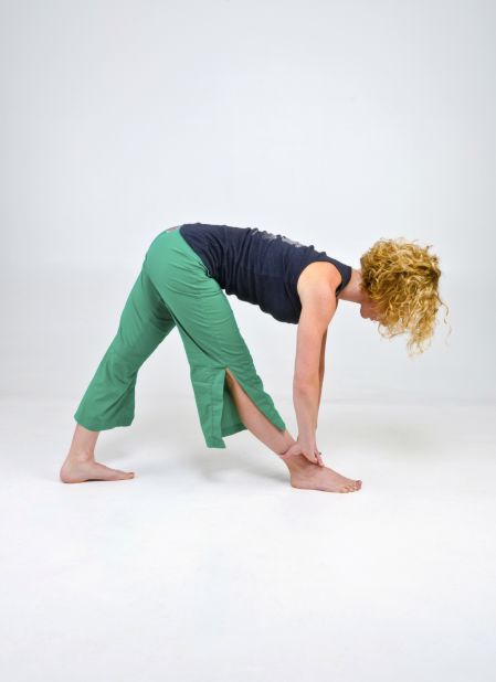 When done correctly, the pyramid pose stretches your hamstrings with proper pelvic alignment.