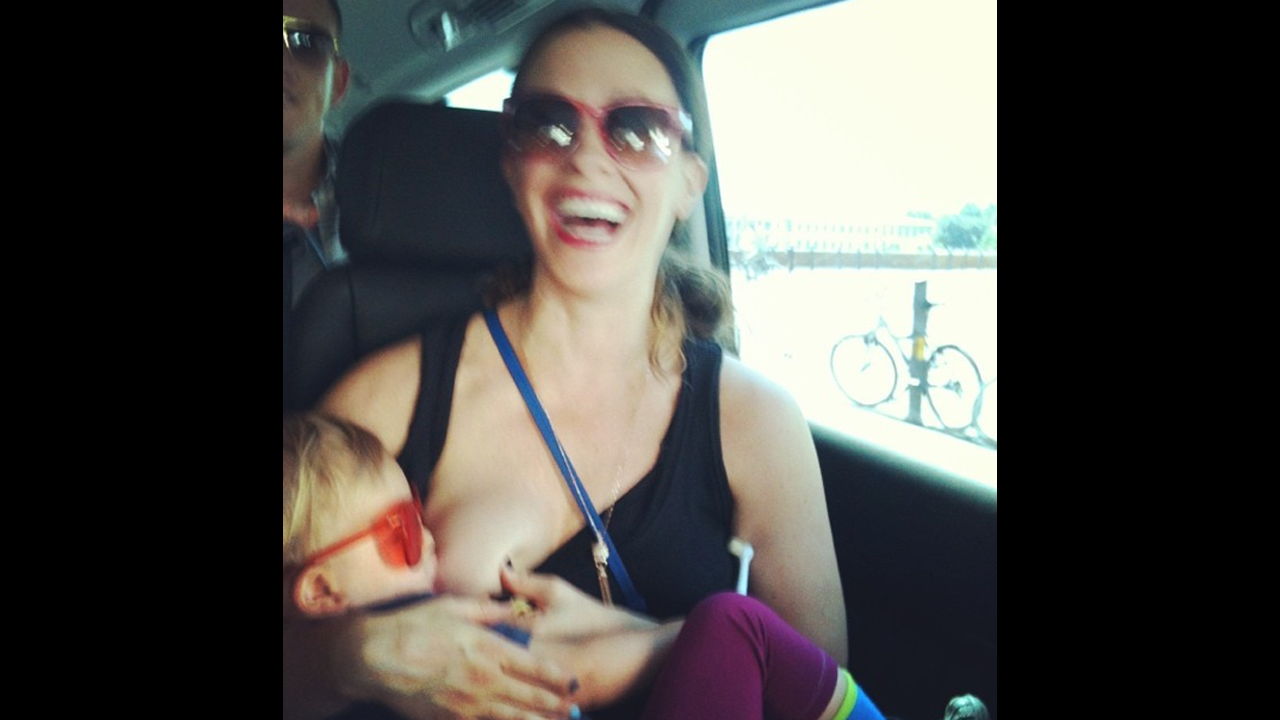 Singer Alanis Morissette posted this more down to earth photo of herself breastfeeding her son Ever while on tour. <a href="http://instagram.com/p/rOgEbCOYM3/" target="_blank" target="_blank">Her message</a>: "family on tour ;) europe 2012 #worldbreastfeedingweek #isupportyou."