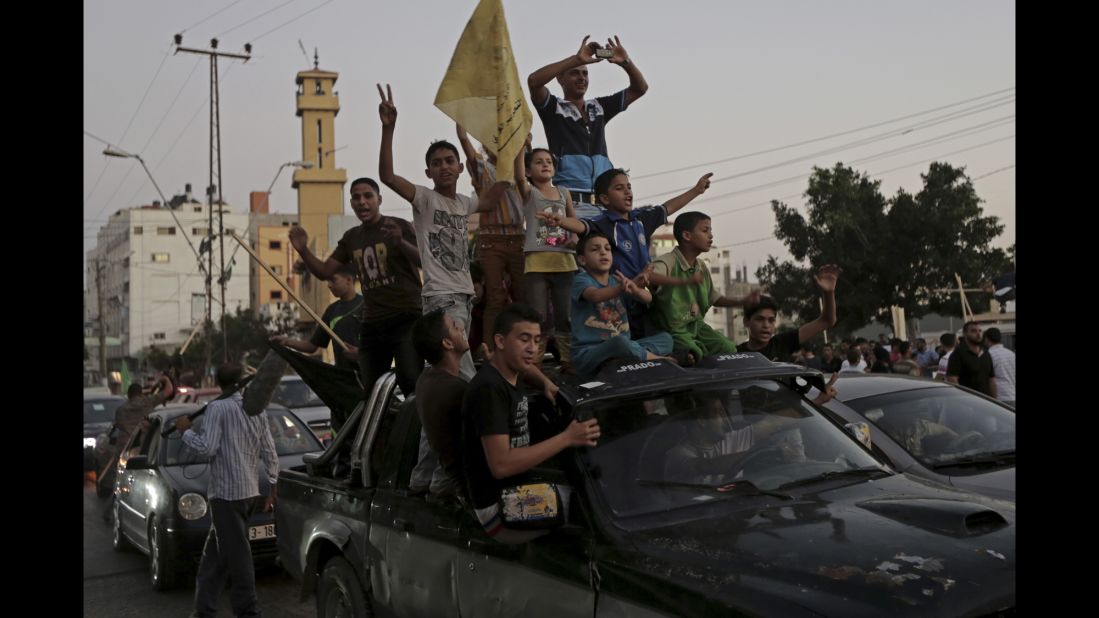 Palestinians in Gaza celebrate a ceasefire between Israel and Hamas on Tuesday, August 26. After more than seven weeks of heavy fighting, Israel and Hamas agreed to an open-ended ceasefire that puts off dealing with core long-term issues. 