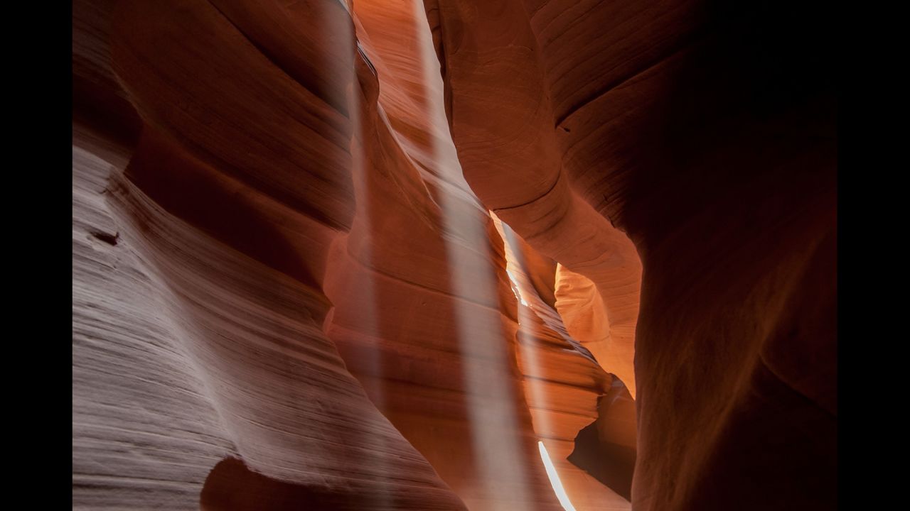 Get to Arizona's Antelope Canyon when the sun is at its highest, travel photographer Gary Arndt says, to see this light streaming through the slot canyon. 