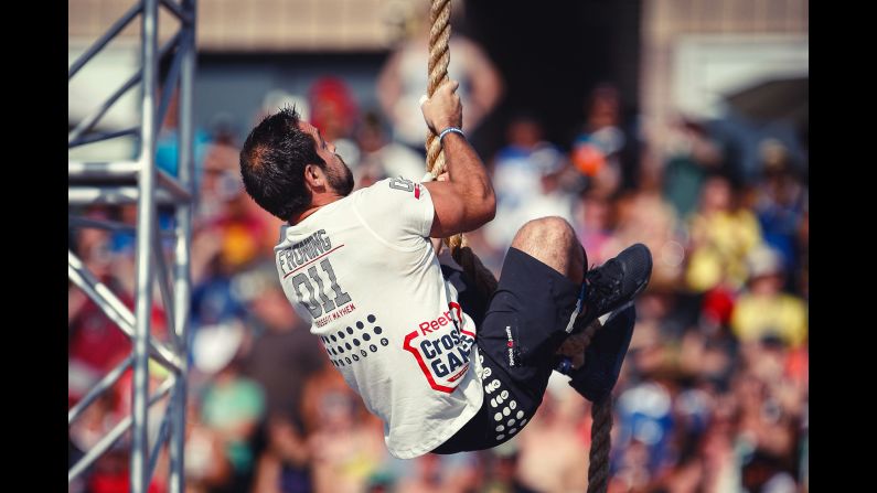 Froning does a rope climb during the <a href="index.php?page=&url=http%3A%2F%2Fgames.crossfit.com%2Fworkouts%2Fgames" target="_blank" target="_blank">Thick N' Quick event</a>. Athletes had to do four rope climbs and three overhead squats with 165 pounds in under 4 minutes.