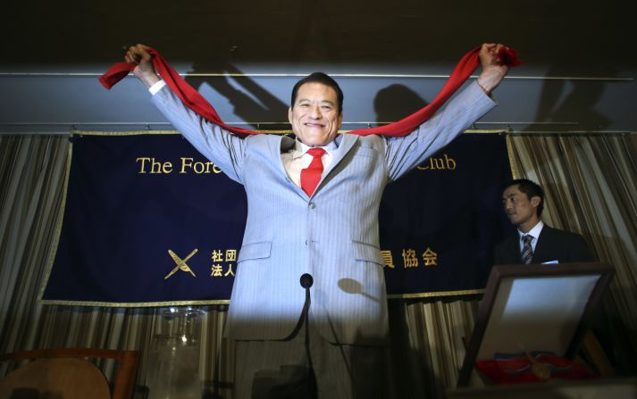 Inoki poses for photographers at a press conference in Tokyo, August 21. He's organized a two-day wrestling competition in Pyongyang, featuring former NFL player Bob "The Beast" Sapp.