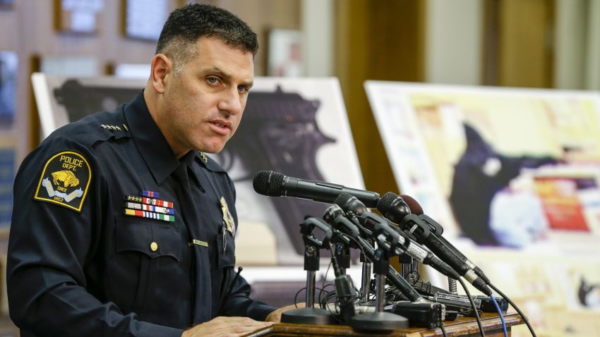 Omaha Police Chief Todd Schmaderer speaks in front of images from security video and an enlargement of an airsoft pistol used in the robbery of a Wendy's restaurant on Tuesday, during a news conference at police headquarters in Omaha, Neb., Wednesday, Aug. 27, 2014. Bryce Dion, a sound technician with the "Cops" television show who was embedded with Omaha police, was killed on Tuesday during an armed robbery at a Wendy's fast-food restaurant. The armed robber was shot and died as well. (AP Photo/)