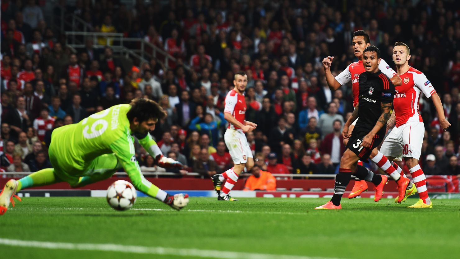Alexis Sanchez fires home his first goal for Arsenal in its Champions League tie with Besiktas.