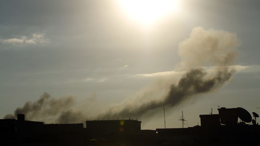 Smoke rises from buildings following an air strike attack early in the morning on August 27, 2014, near military camps in Libya's eastern coastal city of Benghazi. The previous week the United Arab Emirates and Egypt secretly bombed Islamist militia in Libya, apparently catching Washington off guard, as turmoil in the North African country deepened with the Islamists naming a rival premier. AFP PHOTO / ABDULLAH DOMA (Photo credit should read ABDULLAH DOMA/AFP/Getty Images)