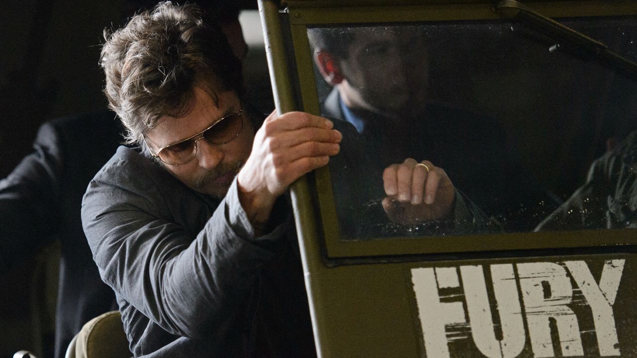 Pitt's wedding ring is visible as he arrives for a promotional photocall for his latest film, "Fury," at Bovington Tank Museum in Dorset, England, on Thursday, August 28.