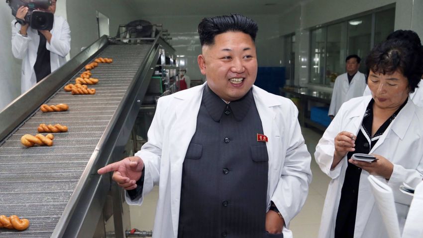 in this undated photograph released by North Korea's official Korean Central News Agency (KCNA) on August 24, 2014, North Korean leader Kim Jong-Un (L) inspects the November 2 factory of the Korean People's Army (KPA) at undisclosed location in North Korea.