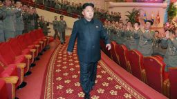 This undated picture released by North Korea's official Korean Central News Agency (KCNA) on July 28, 2014 shows North Korean leader Kim Jong-Un (C) with Korean People's Army (KPA) service personnel, attending a performance given by the State Merited Chorus at the People's Theatre in Pyongyang.