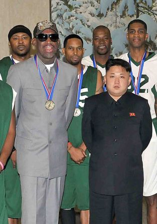 This photo taken on January 8 shows Rodman and Kim with other former NBA players at Pyongyang Gymnasium in Pyongyang. 