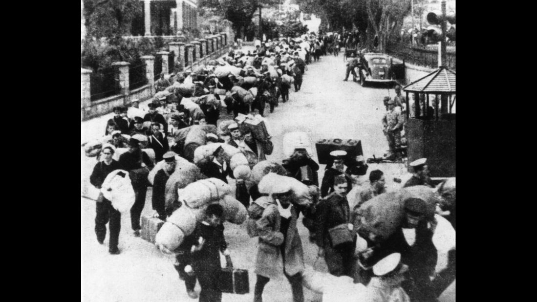 British prisoners of war leave Hong Kong for a Japanese prison camp in December 1941.