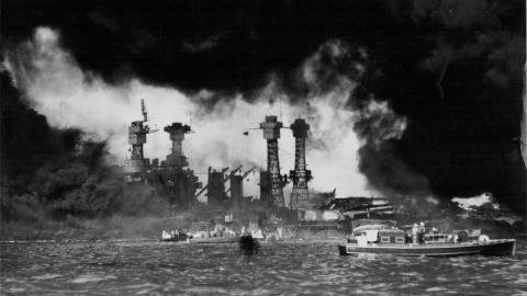 A view of U.S. ships in Pearl Harbor, Hawaii, after the Japanese attack on December 7, 1941. The USS West Virginia and USS Tennessee are in the foreground. The attack destroyed more than half the fleet of aircraft and damaged or destroyed eight battleships. Japan also attacked Clark and Iba airfields in the Philippines, destroying more than half the U.S. Army's aircraft there. 