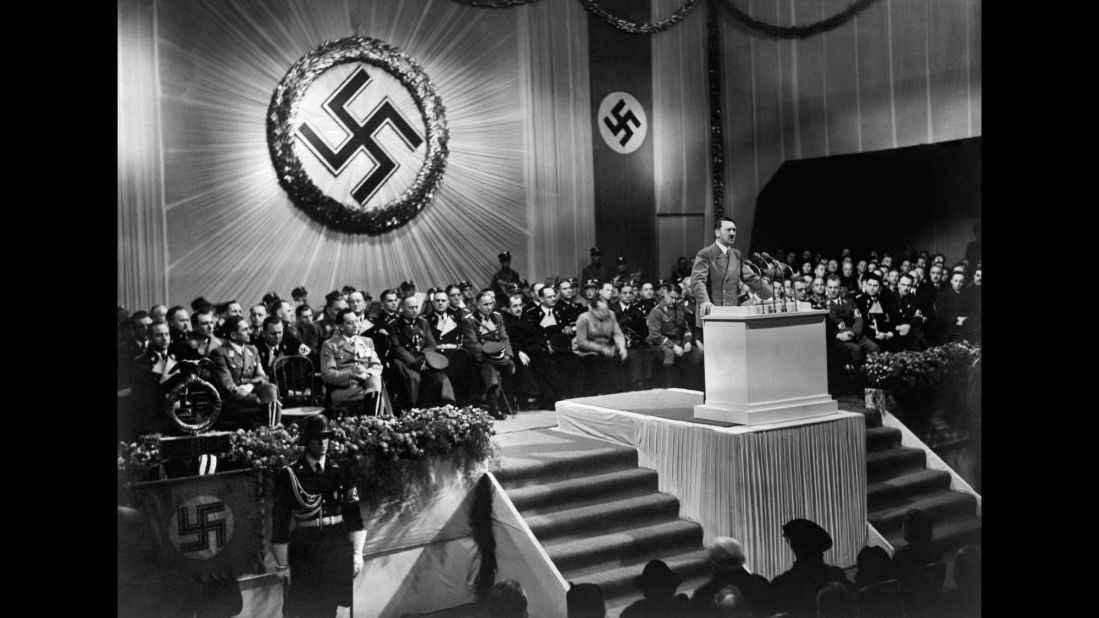 German Chancellor Adolf Hitler speaks to Nazi party officials in 1939, the year of the German blitzkrieg into Poland. Denmark, Luxembourg, the Netherlands, Norway and Belgium soon fell under German control. When France came under occupation less than a year later, Britain was the only remaining Western European nation fighting the Third Reich, and the United States had not yet entered the war.