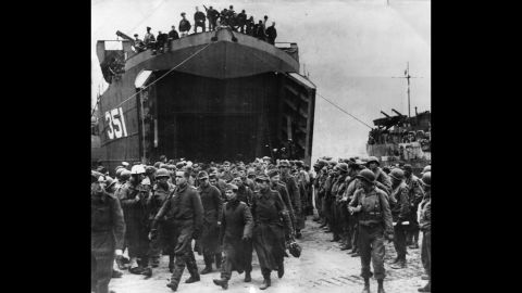 German prisoners captured at the beachhead of Anzio, Italy, leave a landing craft on their way to a prison camp in 1944. The amphibious landing and ensuing battle helped Allied forces break a months-long stalemate south of Rome and ultimately defeat the Germans in Italy.