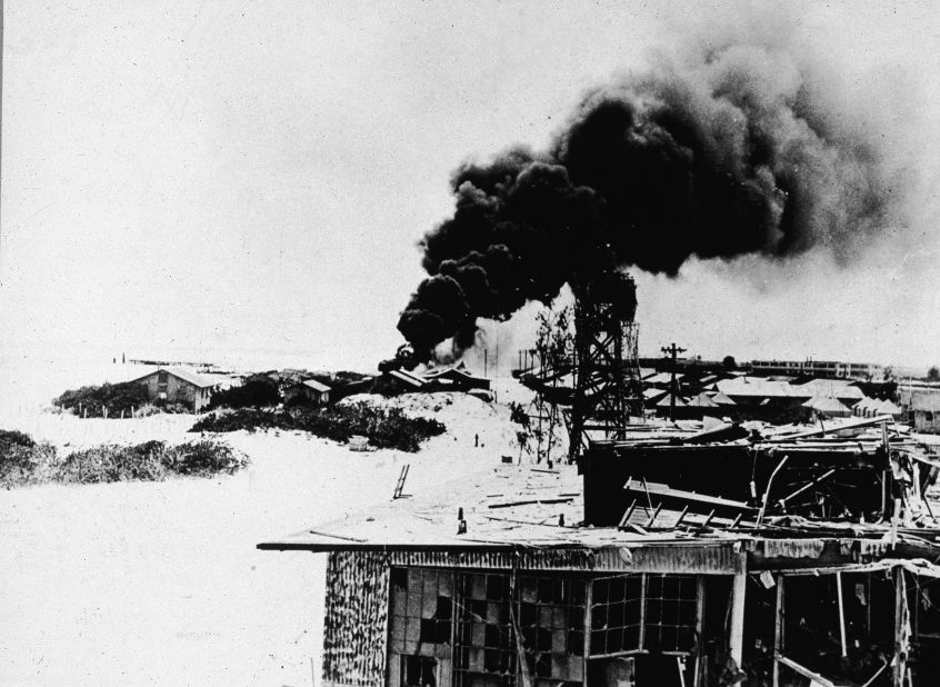 Black smoke rises from demolished buildings after Japanese air forces attacked the U.S. Navy base on Midway Atoll during the Battle of Midway in June 1942. The four-day battle became a major victory for the U.S. Navy, which sunk four Japanese aircraft c